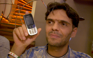 Media Activist Abu Jaffar (pseudonym) shows the first phone he used to record reports from inside Syria.